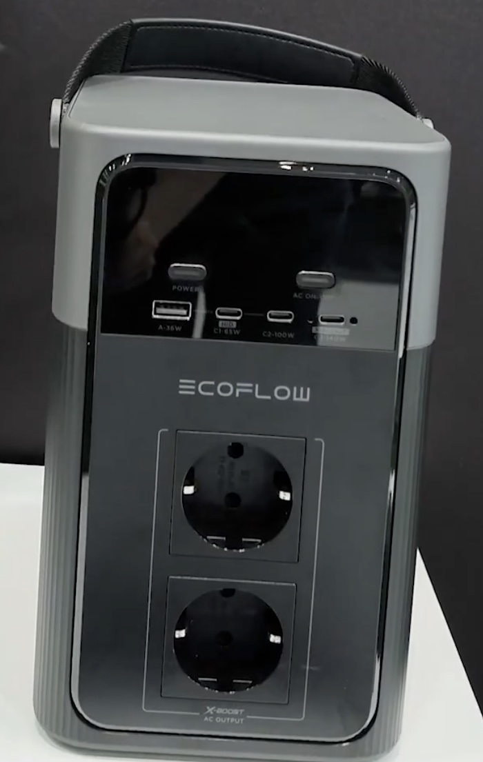 EcoFlow RIVER 520 Gen4: an upright grey power station with a webbing carry strap, a black control panel carrying two buttons and a four-port USB row, and two Schuko outlets stacked in a zone marked X-BOOST AC OUTPUT